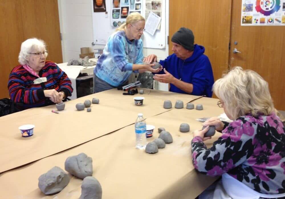 naples art association working with seniors to create with playdoh